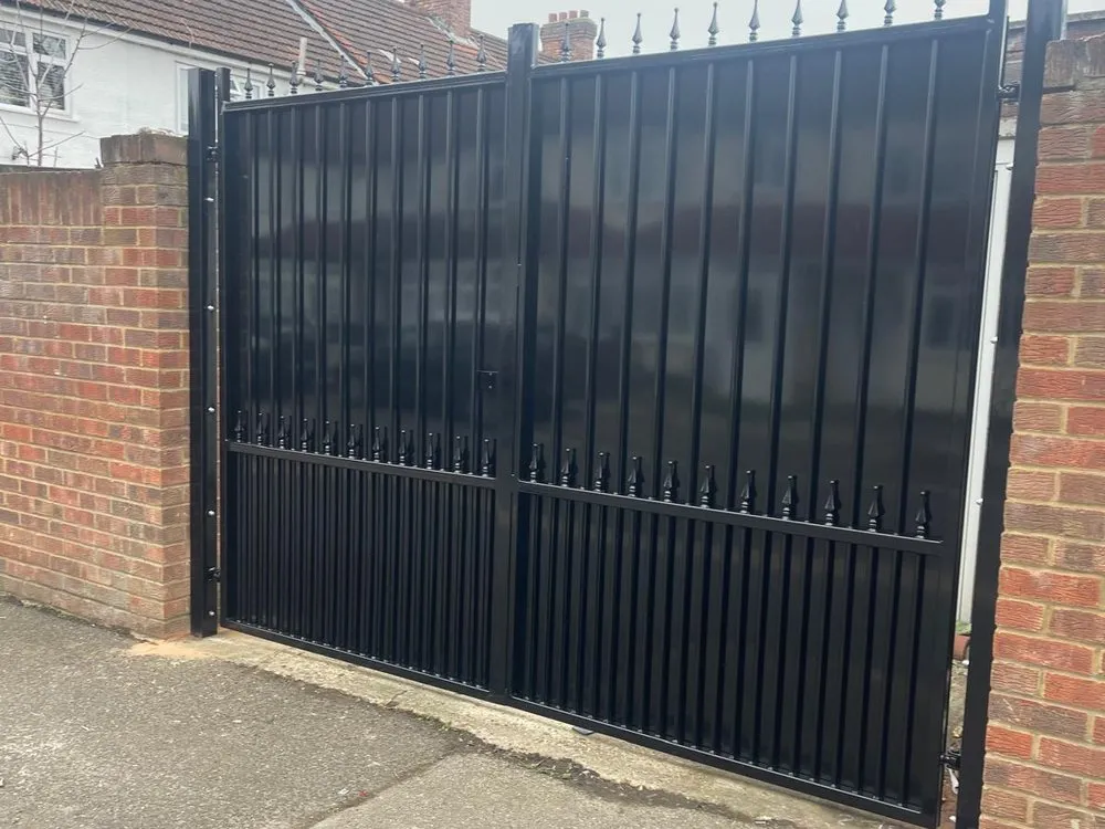 Heavy duty black industrial gates to a commercial yard